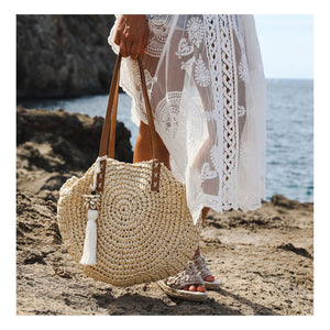 Handmade macrame bag charm in Boho and Ibiza style with cowrie shells and tassel.