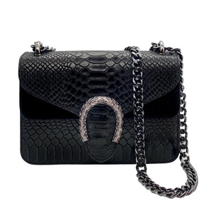 Black shoulder bag made of genuine leather with chain in python design