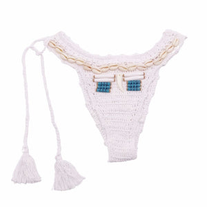 Women's knitted bikini pant in white with shells and tassel. Crochet bikini in Ibiza and Boho style.